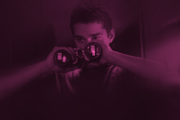 Shia LaBeouf looking through binoculars in Disturbia