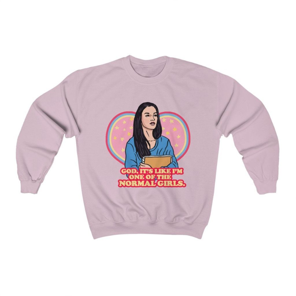 Product photo of pastel crew neck sweatshirt with retro illustration of Jennifer Check (Megan Fox) from Jennifer's Body with movie quote below