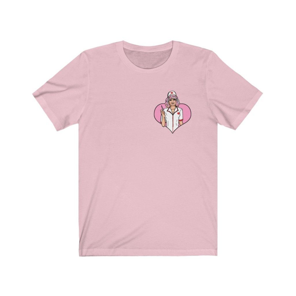 Product photo of pastel pink crew neck tshirt with retro illustration of Cassandra (Carey Mulligan) from Promising Young Woman framed in a pink heart