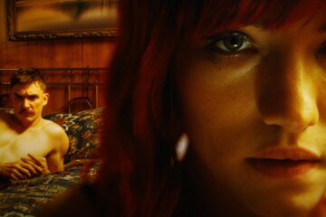 Closeup of Willa Fitzgerald with Kyle Gallner in background in Strange Darling